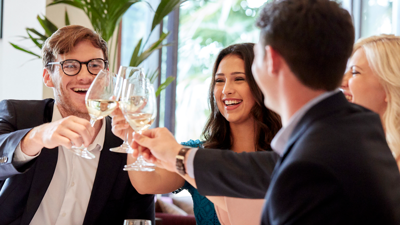 Friends Celebrating Over Drinks